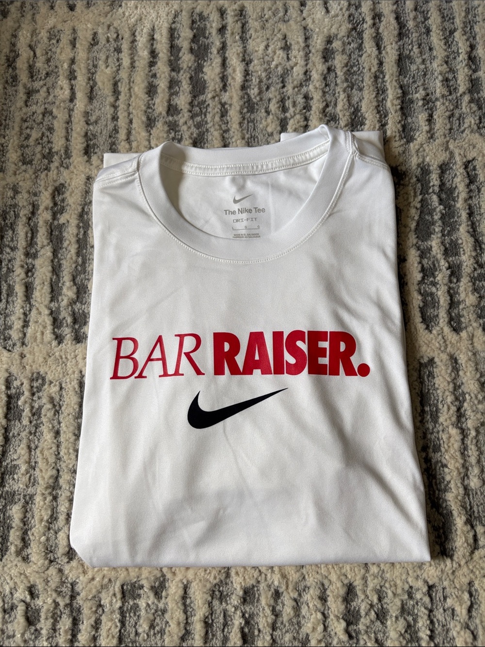 Nike Men’s White Short-Sleeve "Bar Raiser" Graphic Tee with Black Swoosh